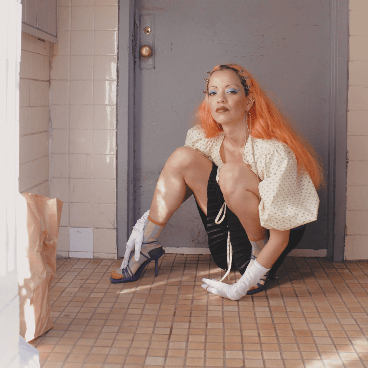 Woman with orange hair looking at the camera