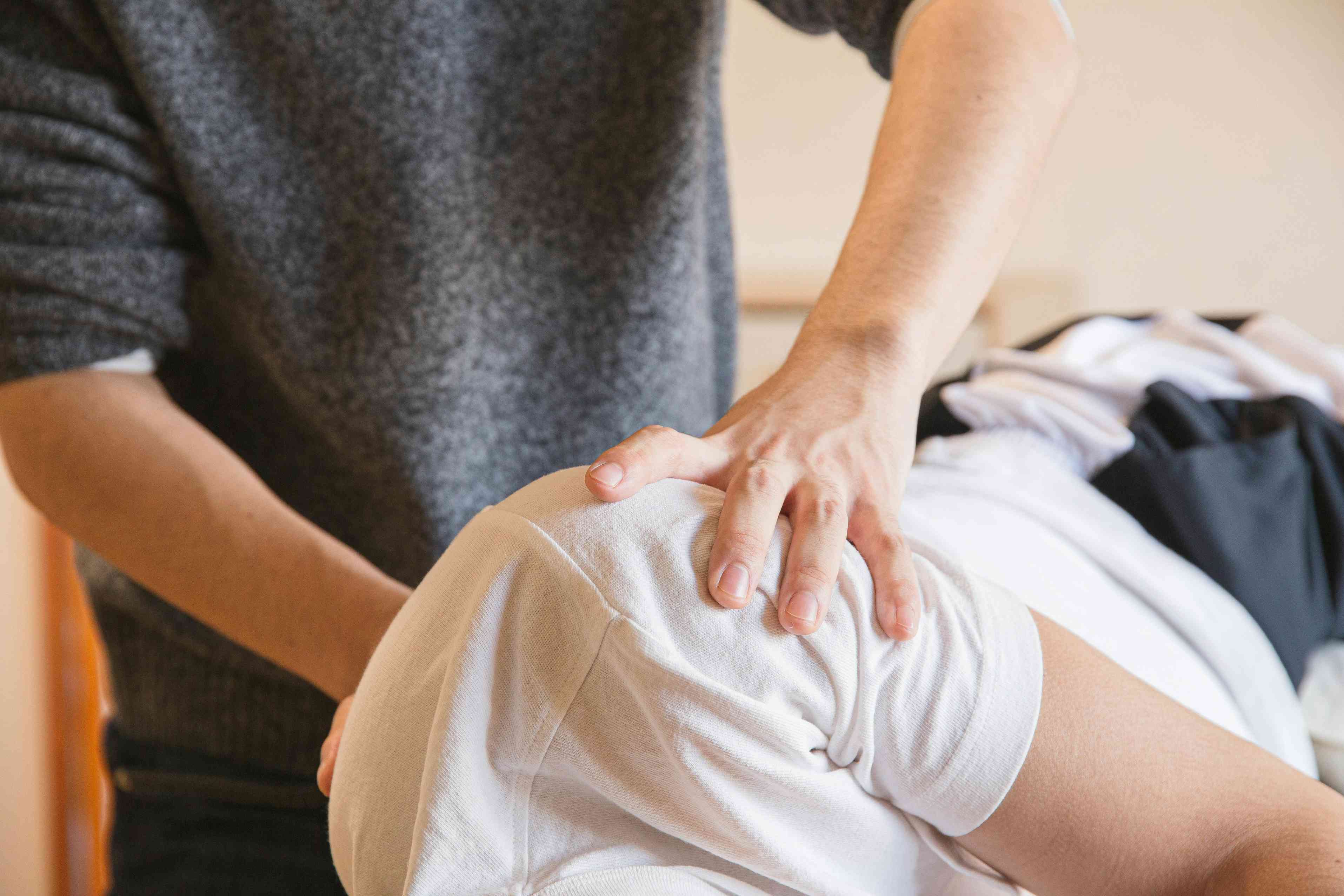 person performing shoulder mobility stretch at Summit Osteo & Performance Ringwood