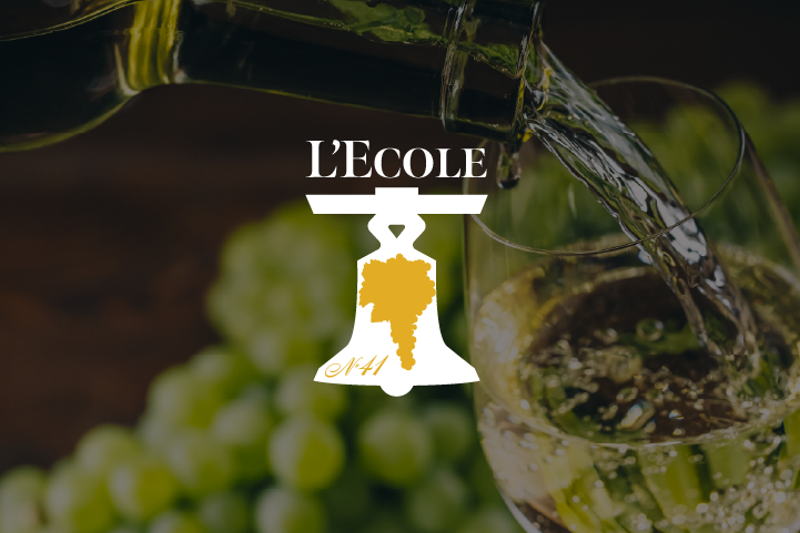 Cover image with the L'Ecole logo and a background of wine being poured into a glass.