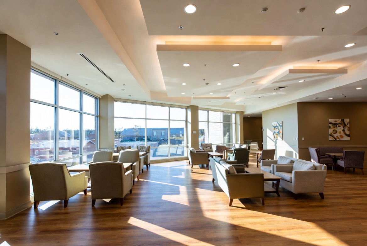Modern Texas assisted living community common area with energy-efficient lighting and HVAC – helping senior living facilities reduce electricity costs in 2026