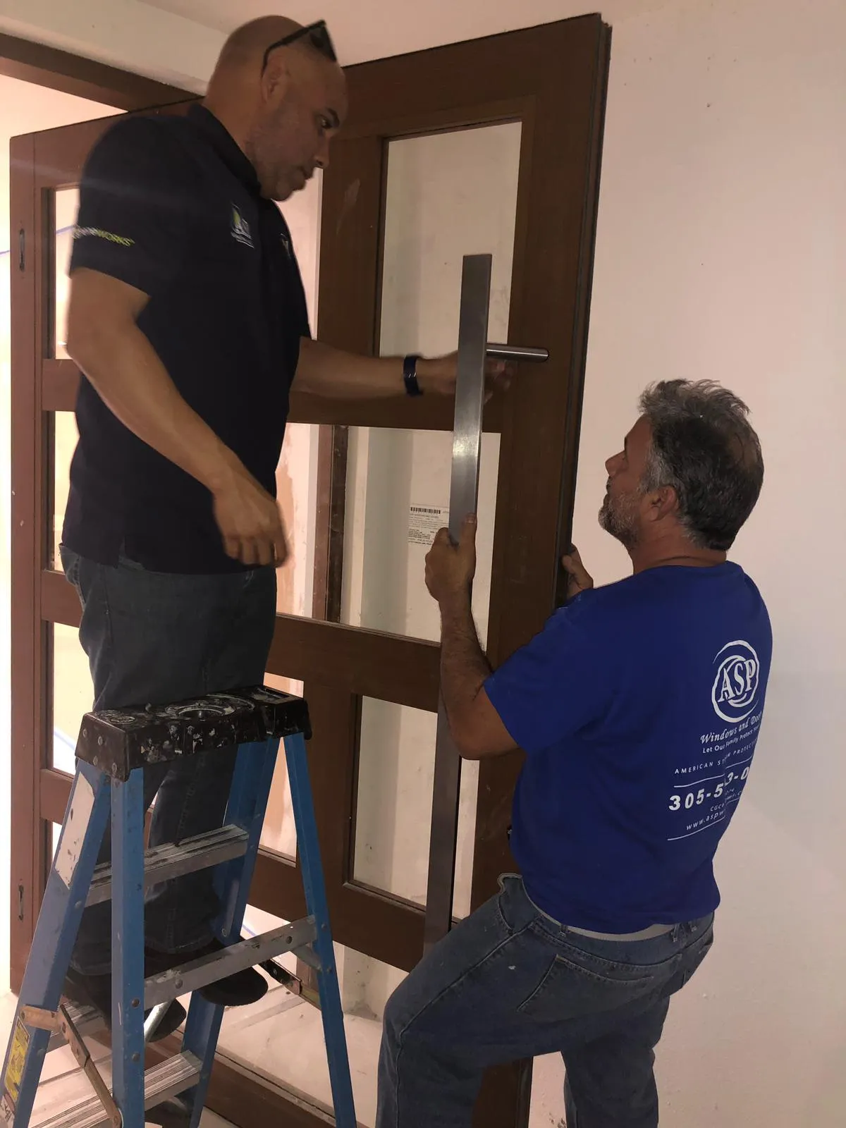 Impact window installation Miami technician at work