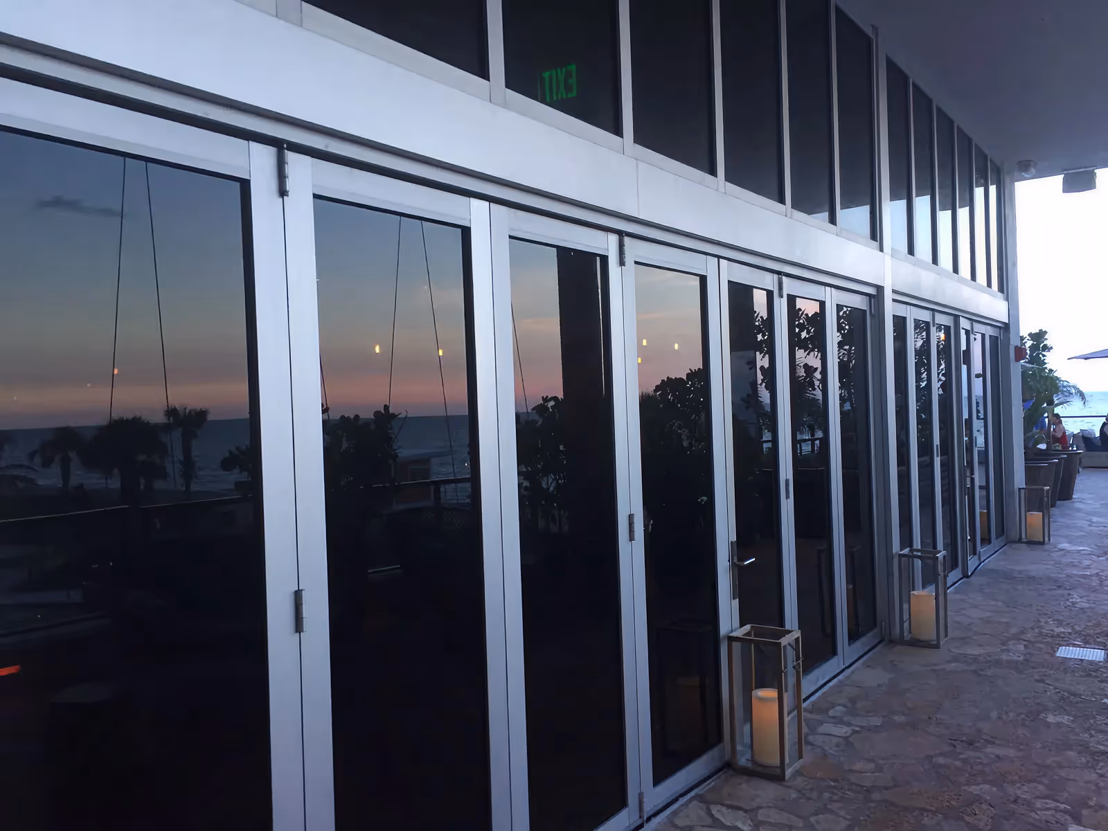 Sliding impact glass doors Miami commercial exterior