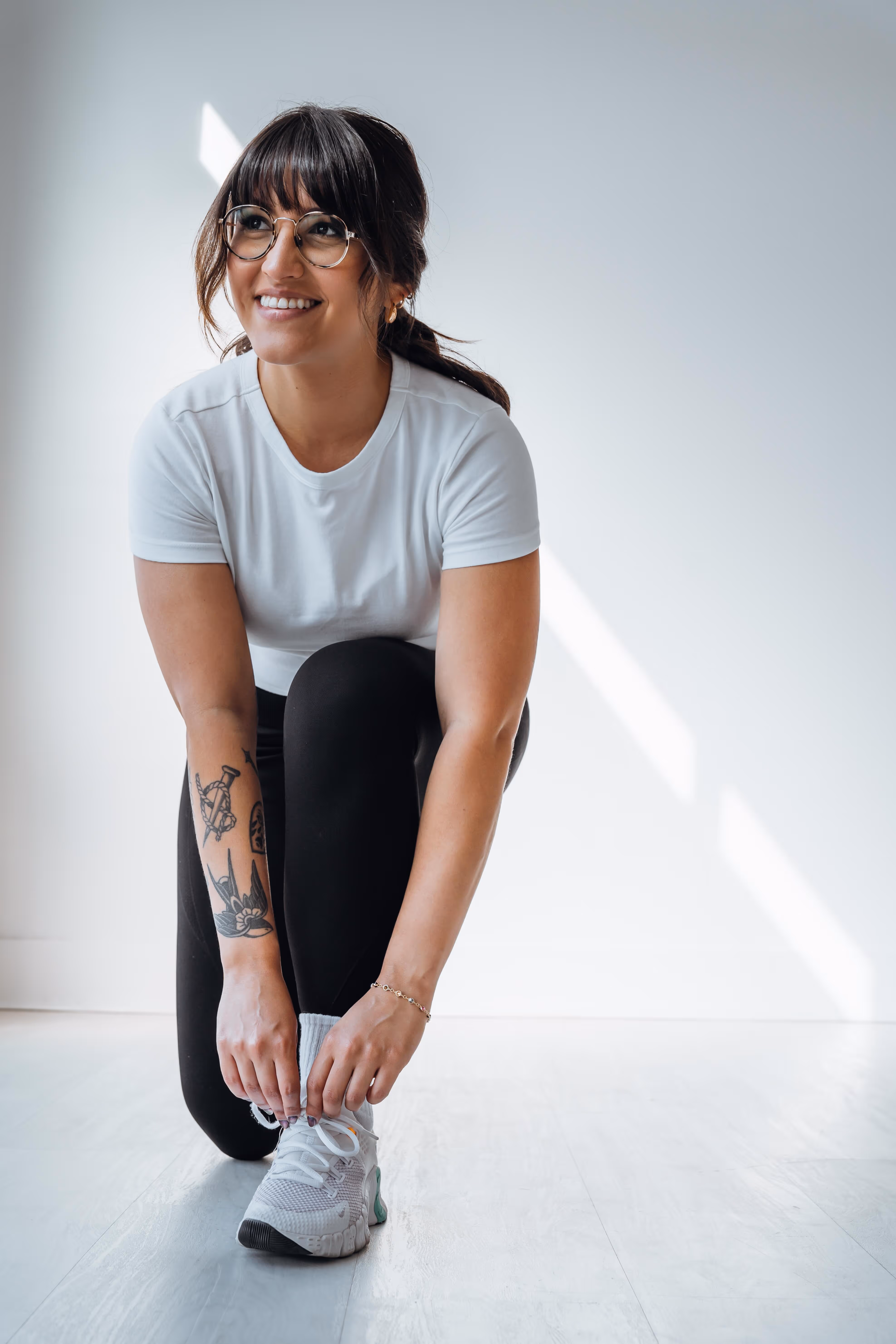 a sporty woman posing for a Nike brand shoot