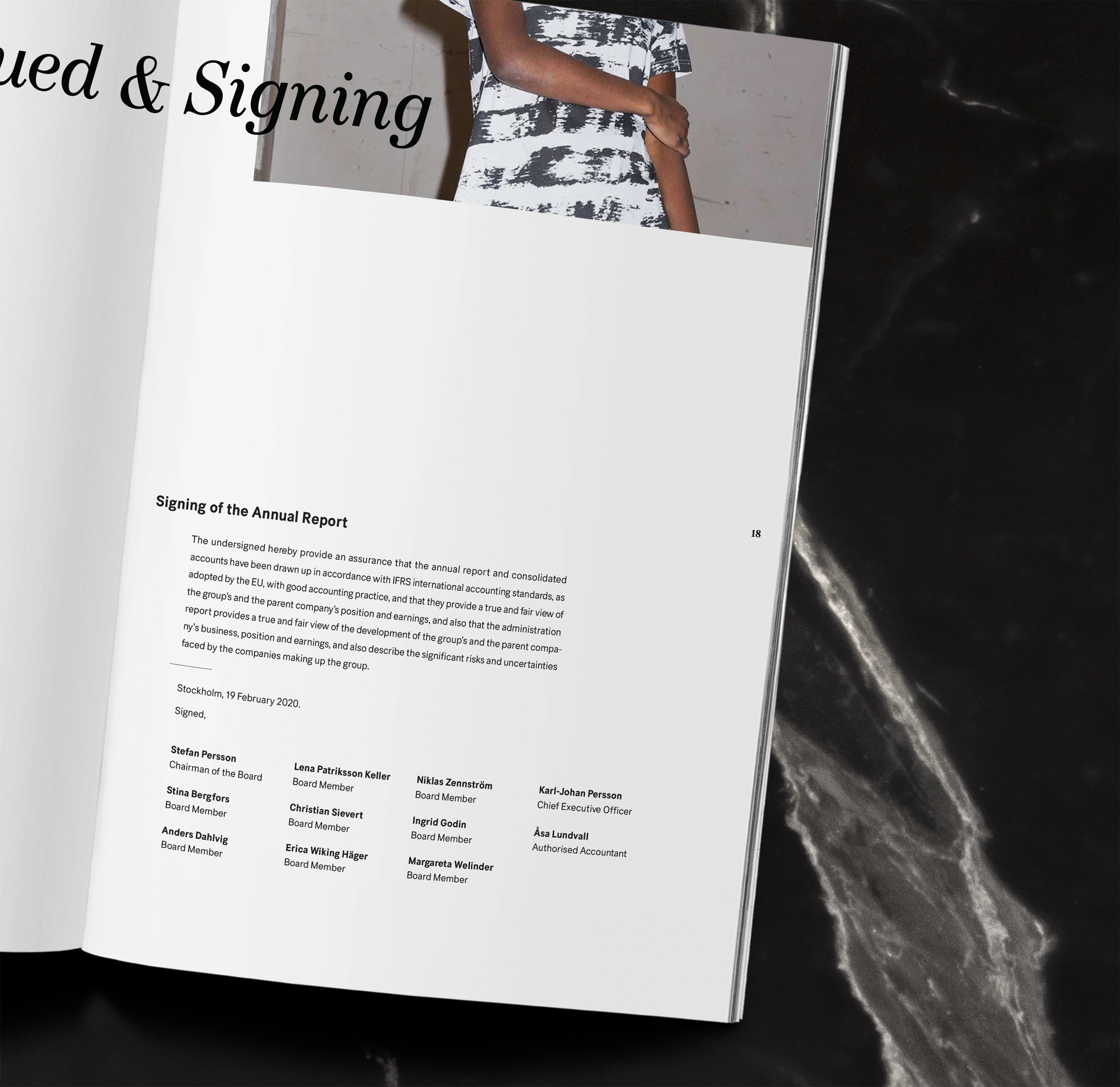 Open booklet showing a page titled 'Signing of the Annual Report' with a statement and signatures of board members and executives.