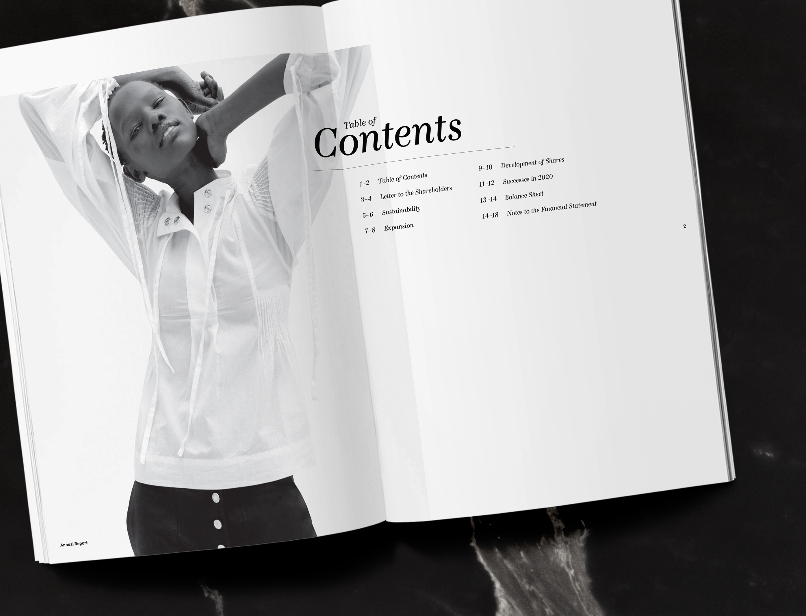 Open booklet showing a black and white photo of a woman on the left page and a table of contents on the right page.