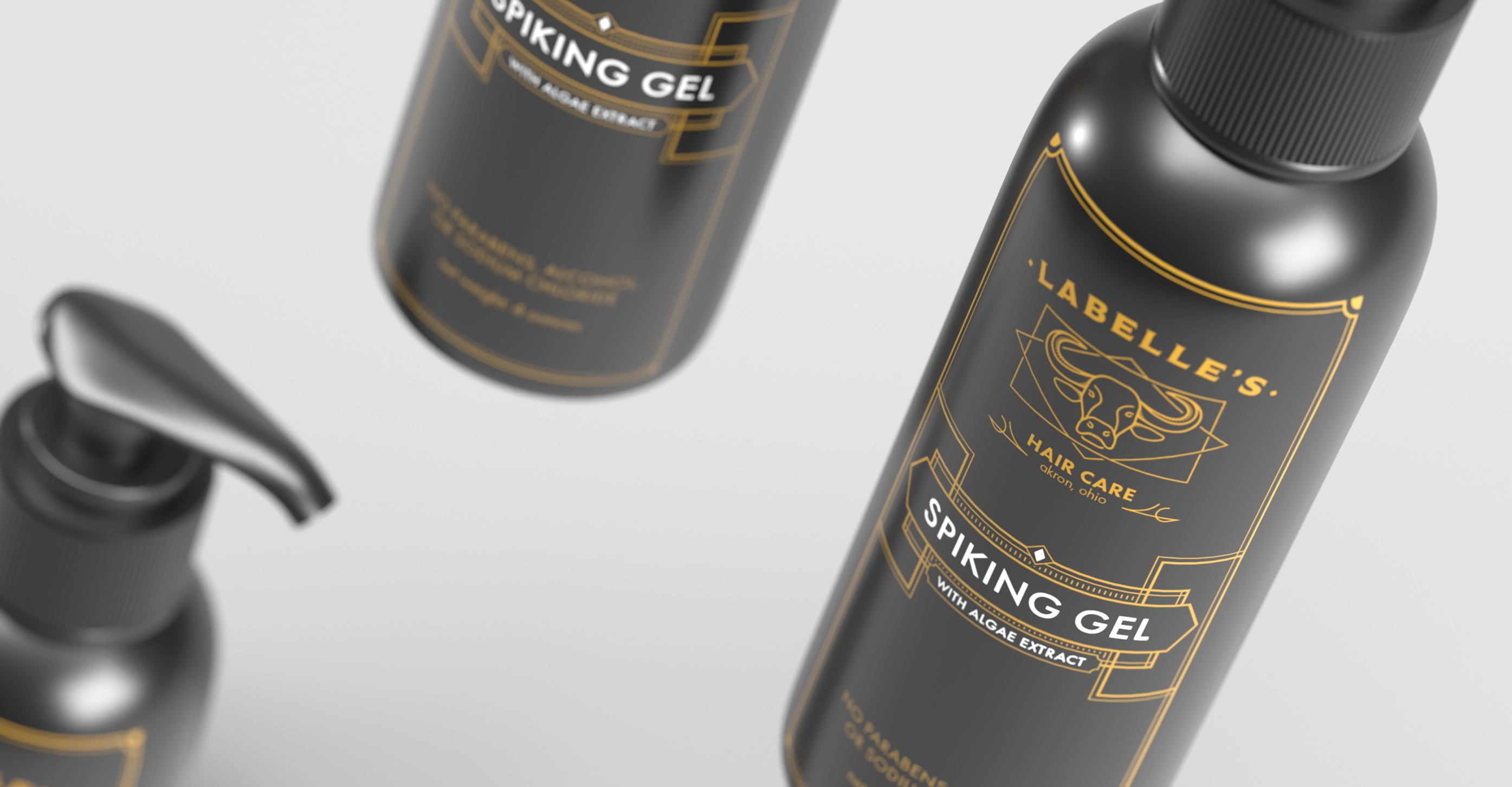 Close-up of floating black bottles labeled 'Labelle's Hair Care Spiking Gel with Algae Extract' in gold and white text.