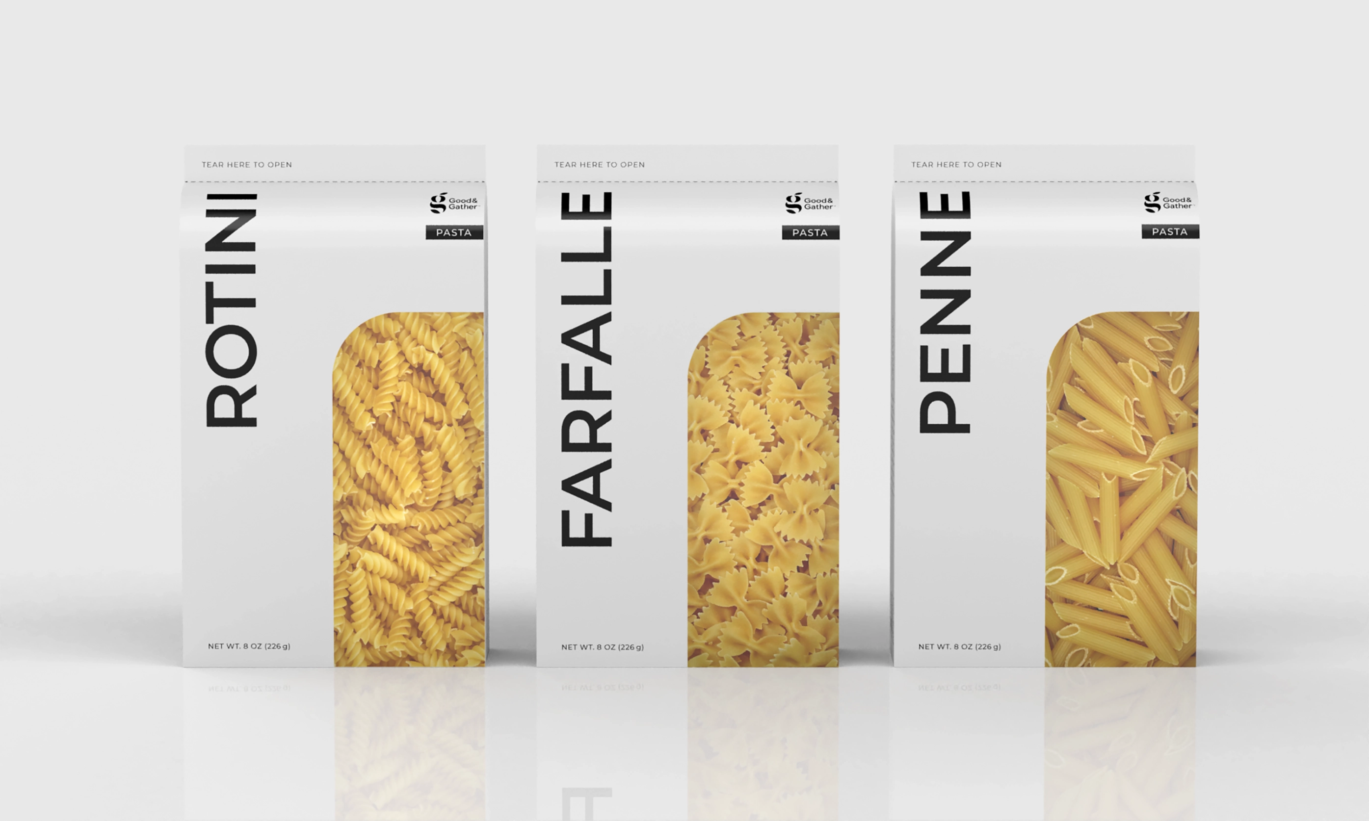 Three simplistic geometric packages of Good & Gather pasta showing rotini, farfalle, and penne varieties with clear windows displaying the pasta shapes.