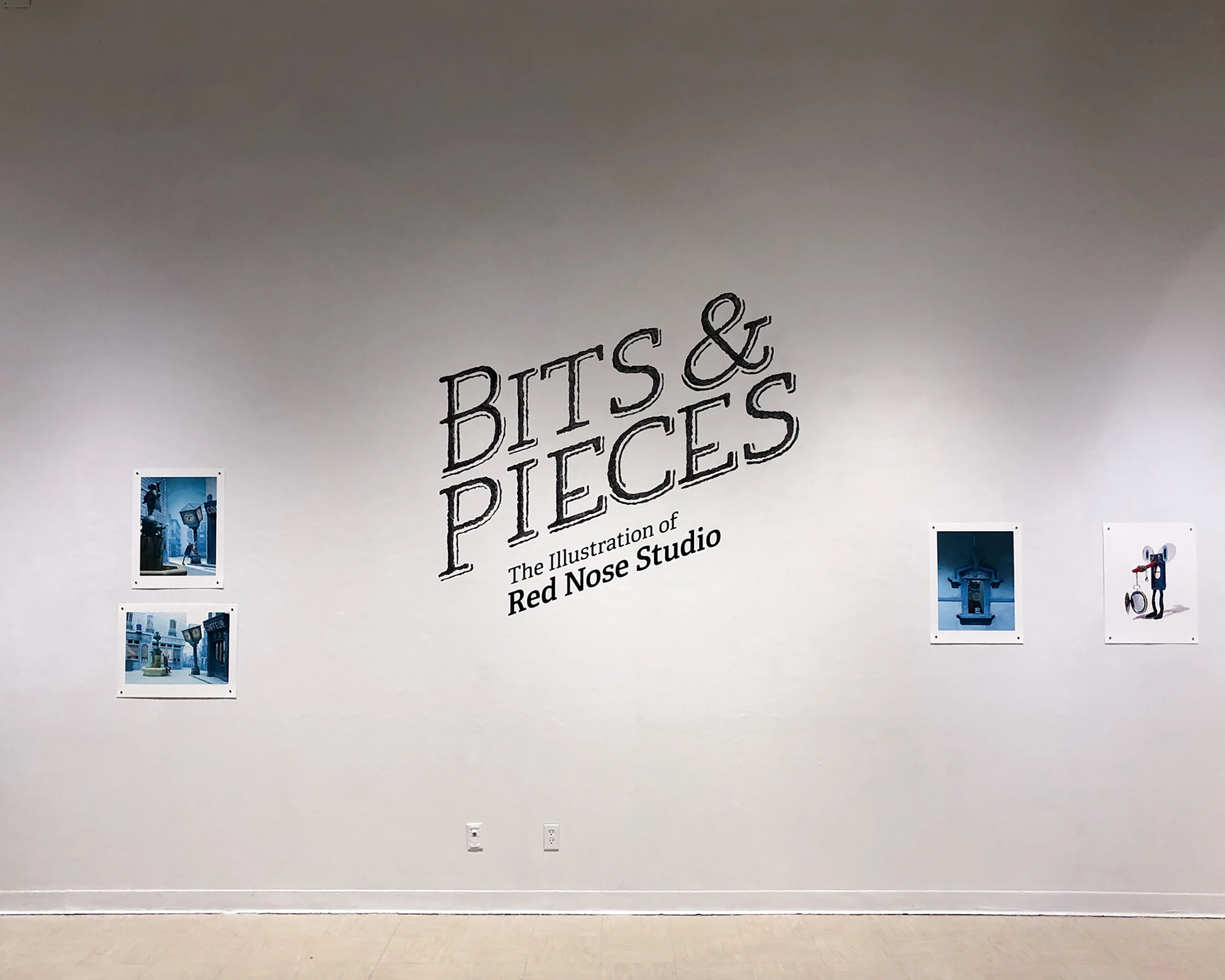 White gallery wall with four small blue-themed illustrations and large text reading 'BITS & PIECES The Illustration of Red Nose Studio' in the center.