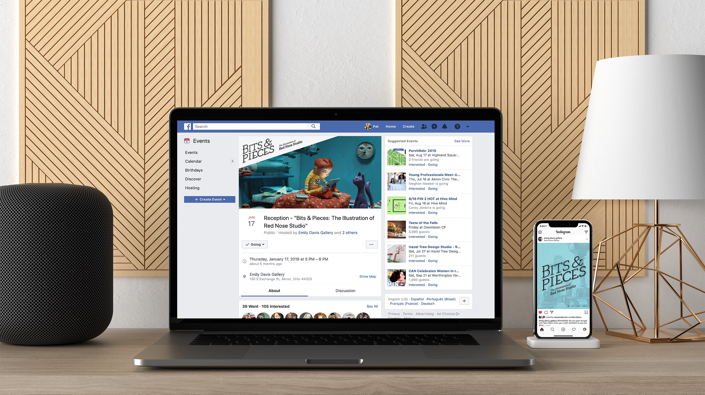 Laptop on a wooden desk displaying a Facebook event page for 'Bits & Pieces: The Illustration of Red Nose Studio' next to a smartphone showing an Instagram post of the same event.