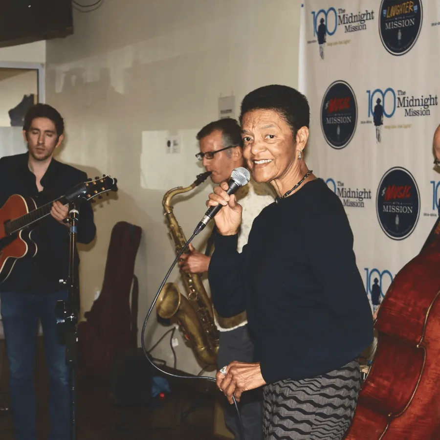 Musicians performing at an indoor community event