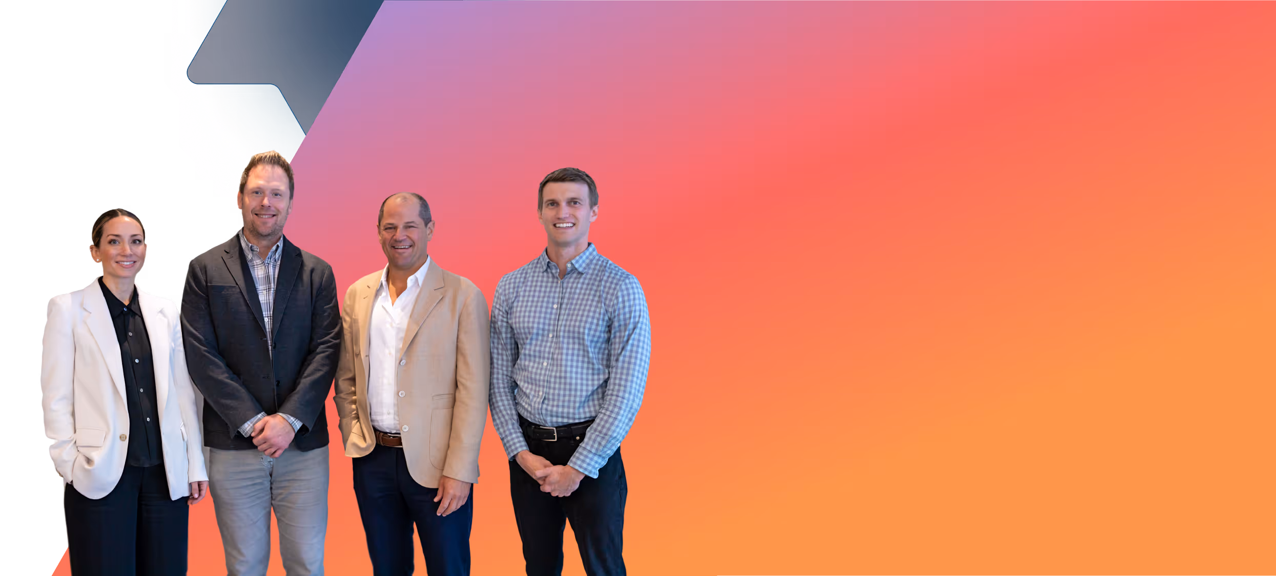 Four professionally dressed people smiling in front of a gradient orange to pink background.