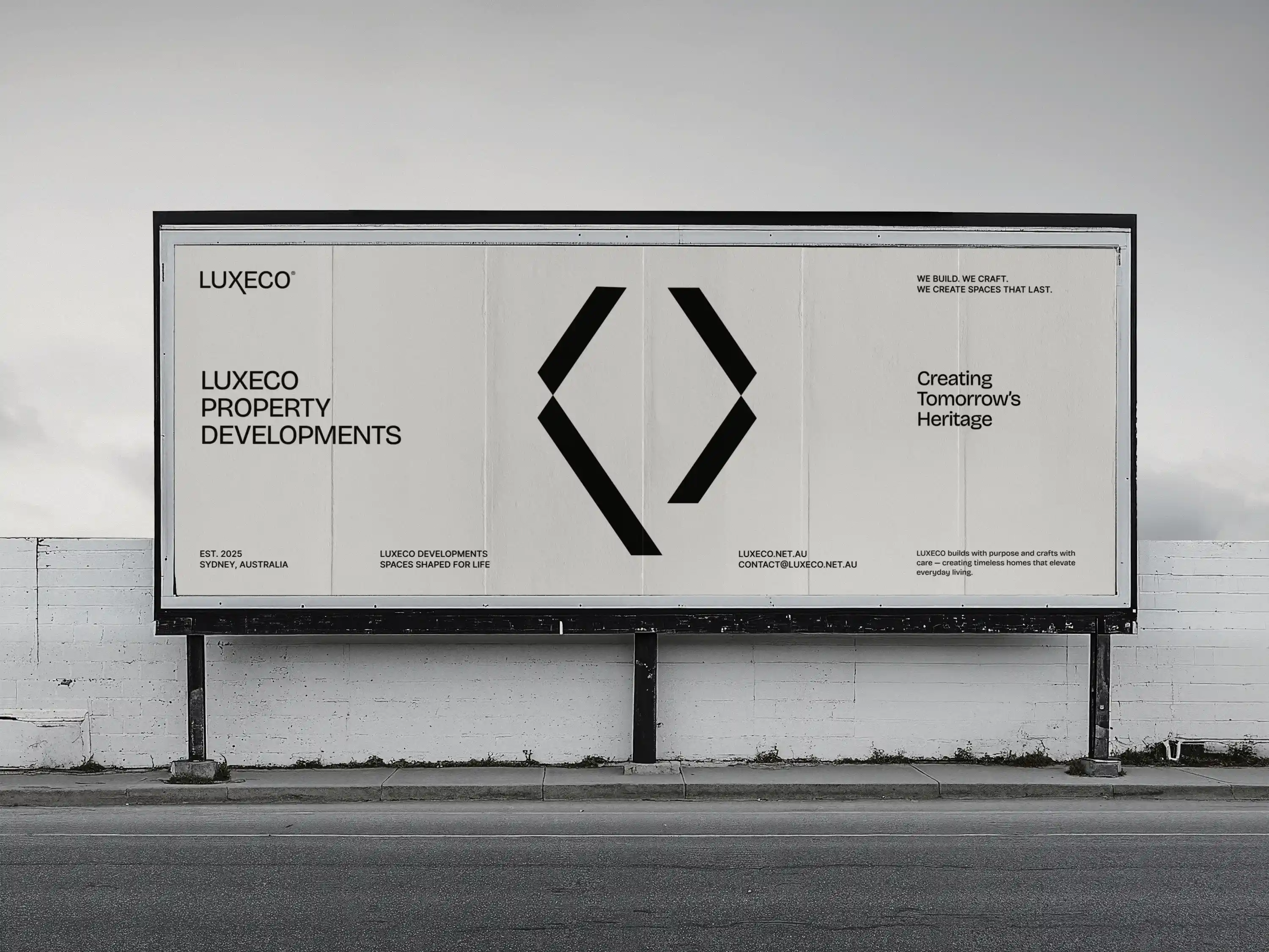 Billboard for LUXECO Property Developments with black text and a large black logo on a white background.