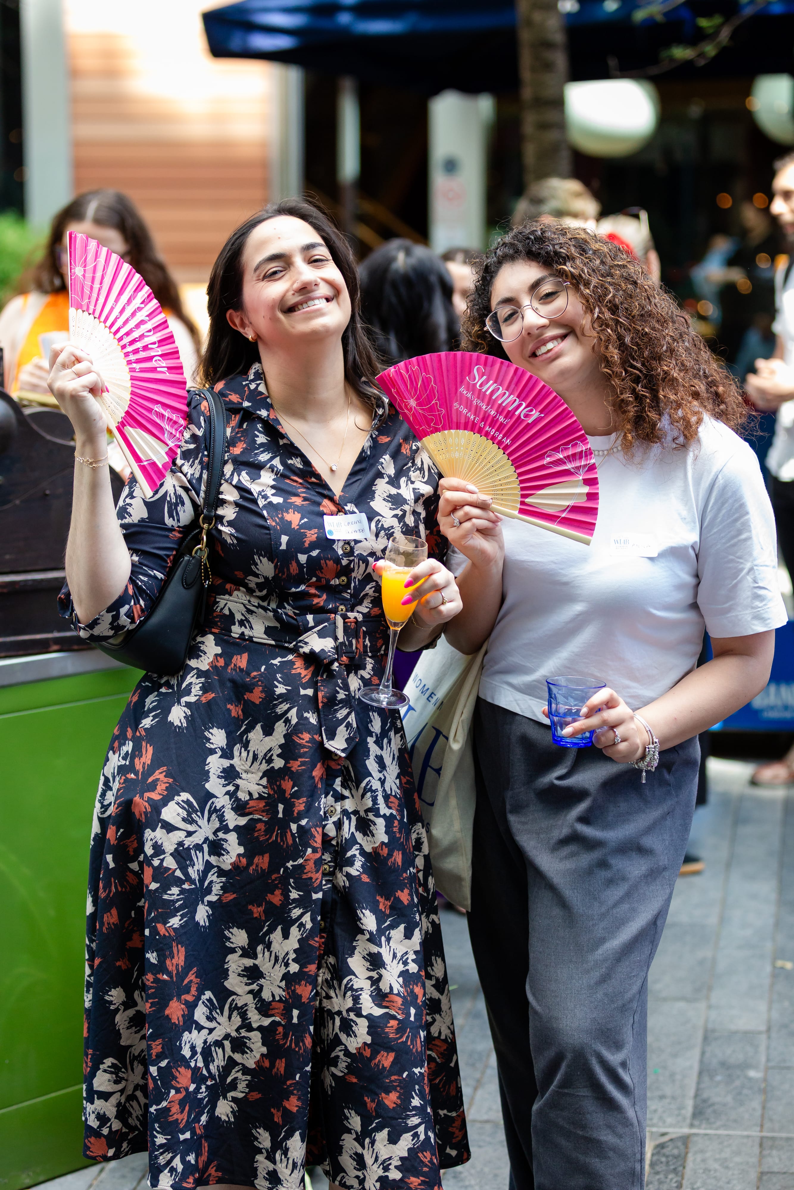 Group of young adults engaged in conversation at an indoor social gathering.