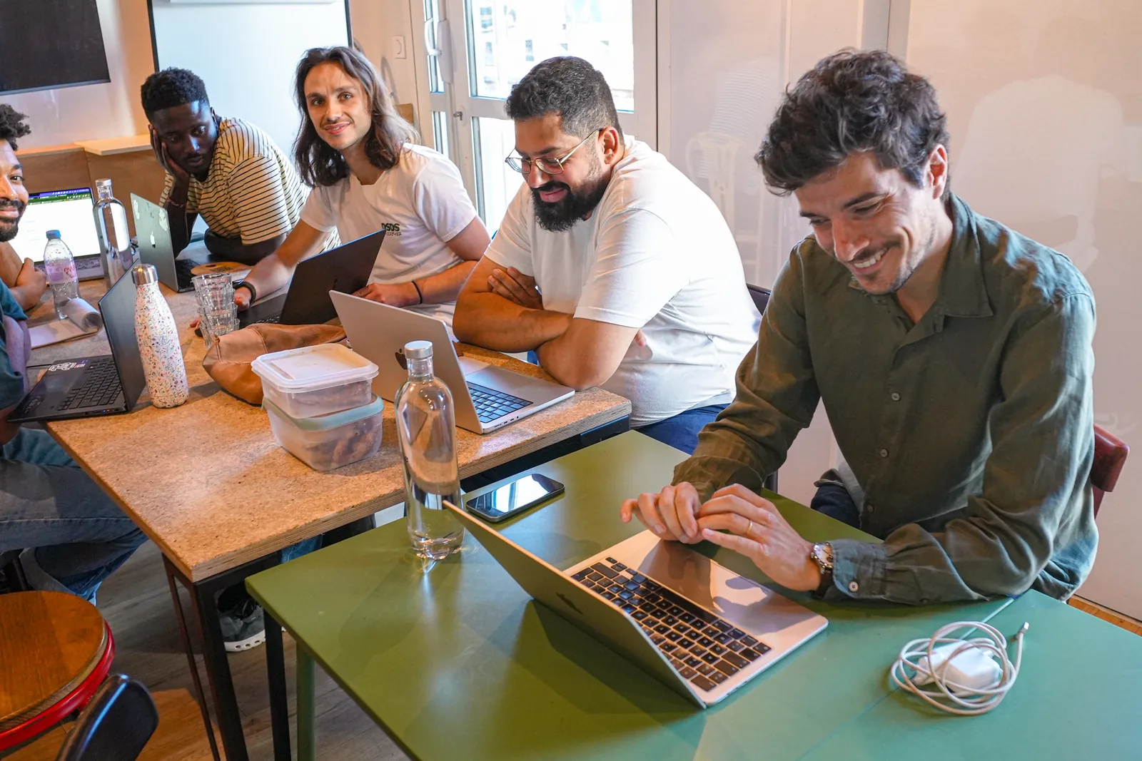 The Cobl team working together around a table