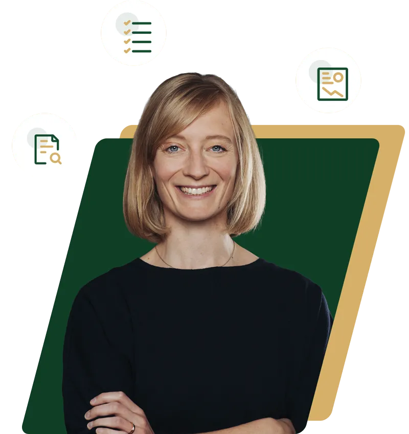 Smiling woman with blonde hair wearing a black top and crossing her arms.