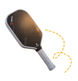 Black pickleball paddle with a silver handle and orange dashed arrow indicating rotation direction.