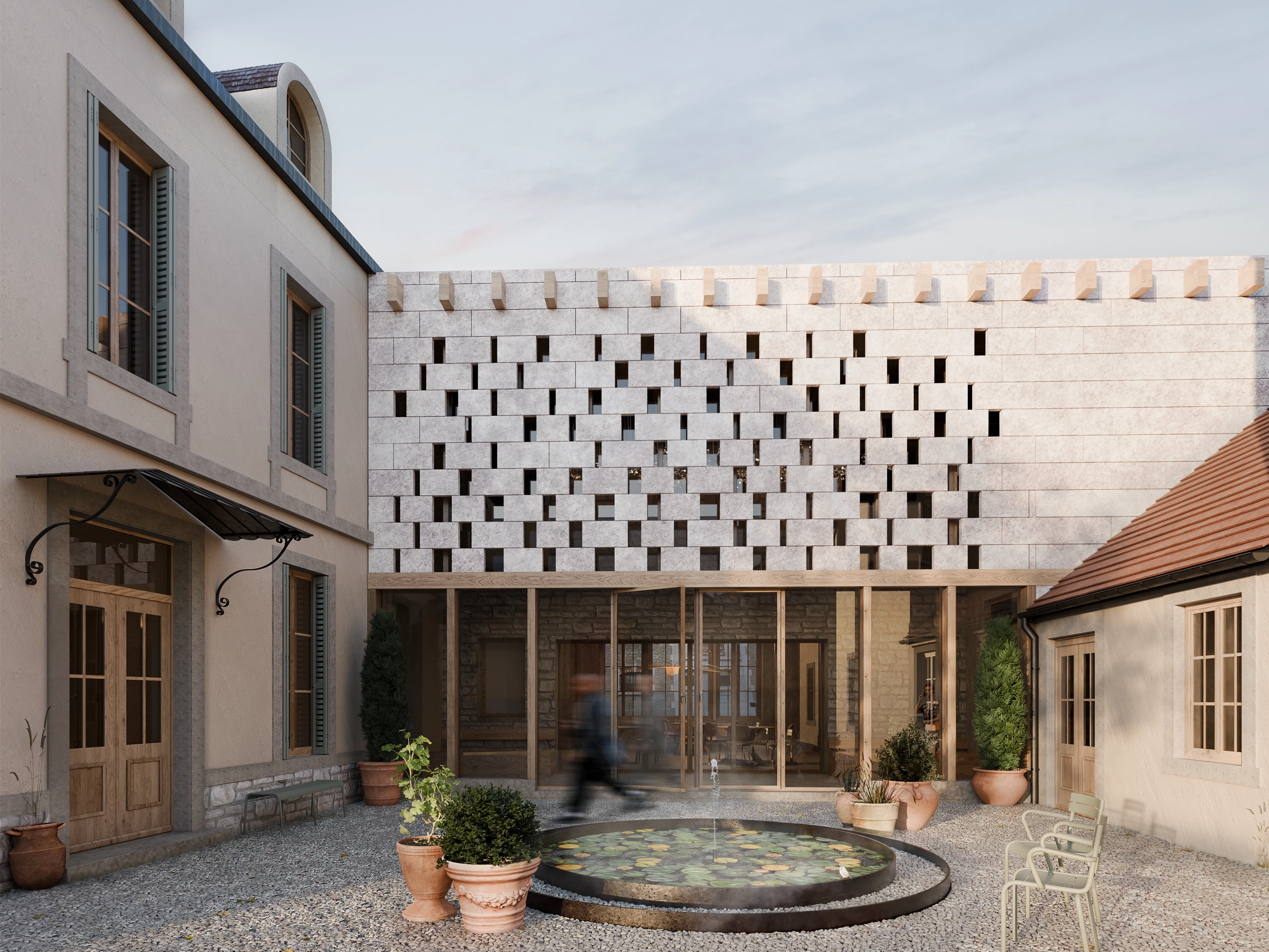 Close-up of a building facade featuring a geometric pattern of staggered rectangular stone blocks with narrow vertical windows between them.