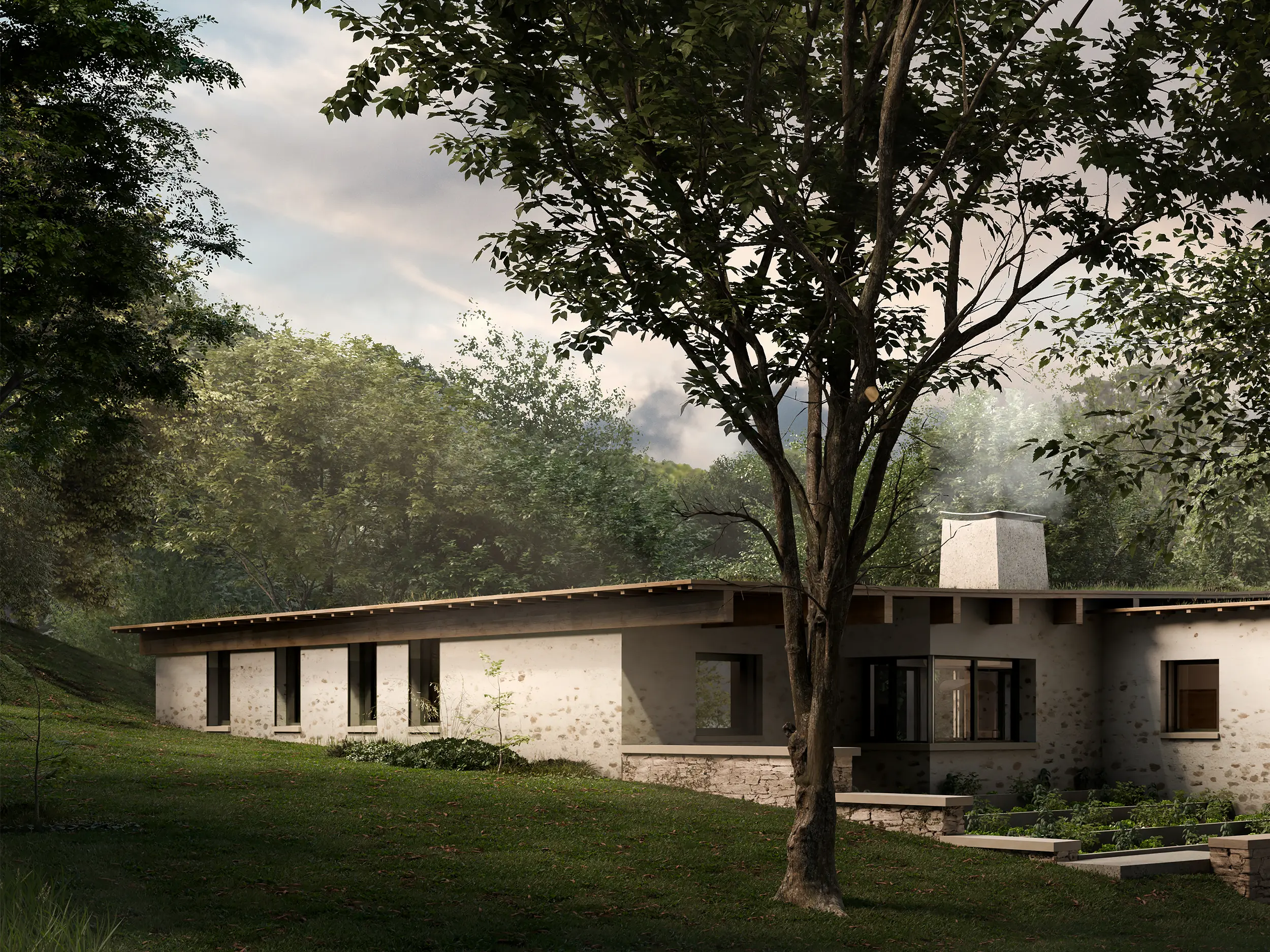 Modern agricultural building with wooden paneling and large glass garage doors situated behind a grassy field.