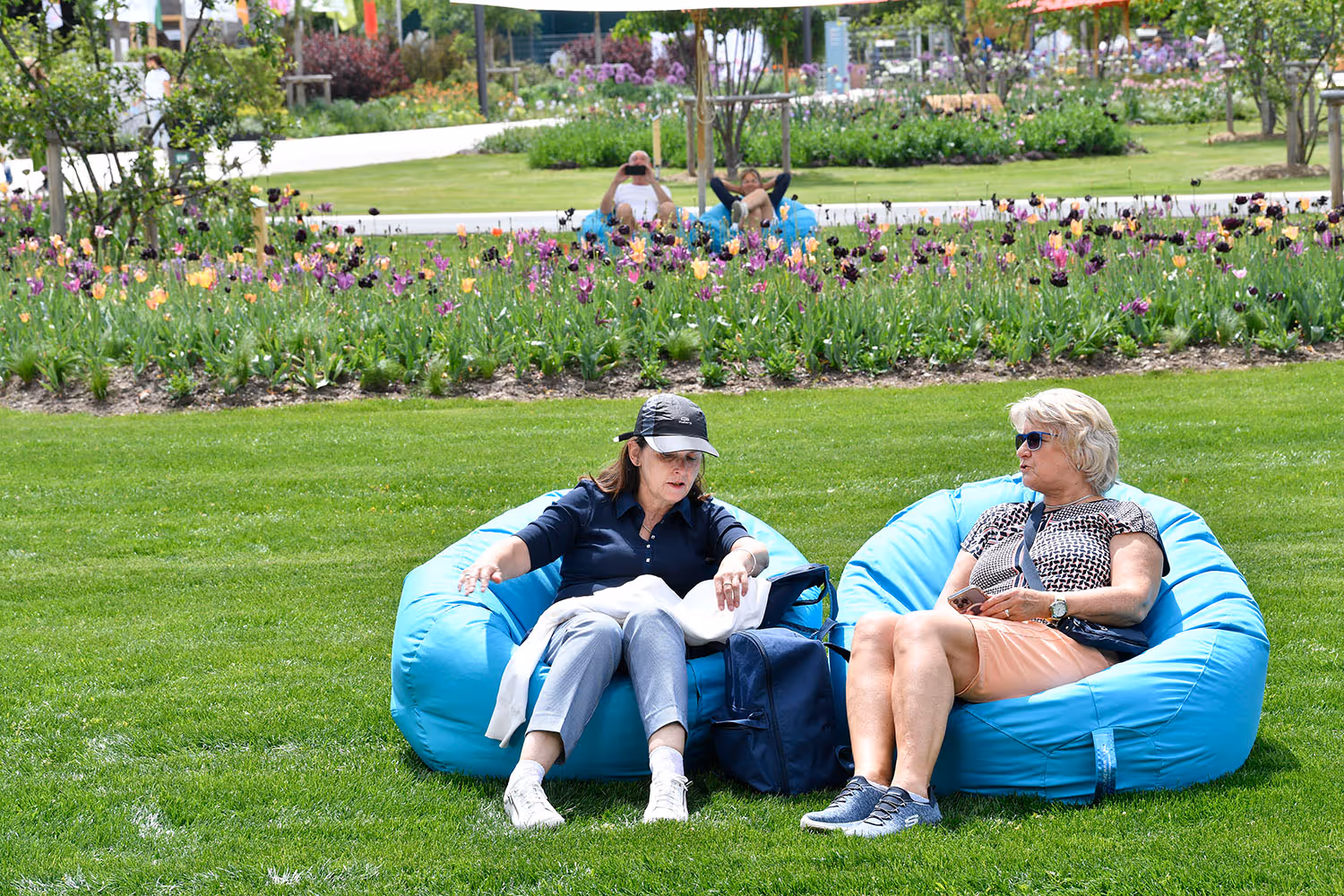 two women sitting on chairs