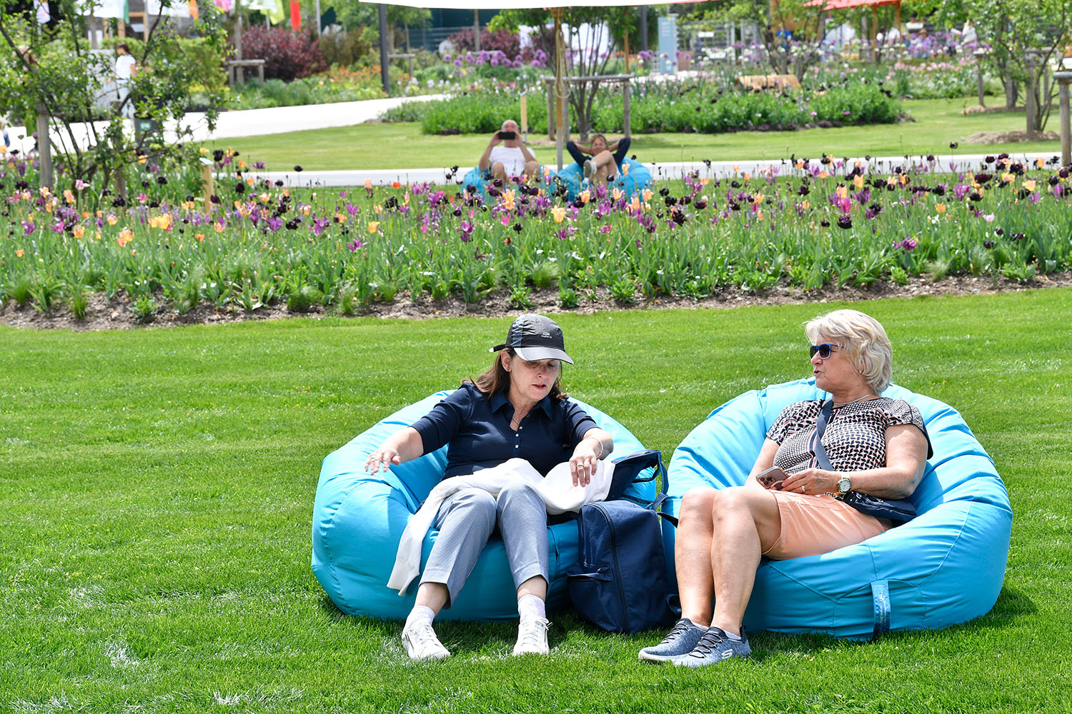 two women sitting on chairs