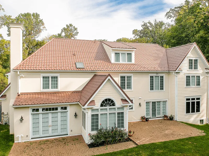 covered patio with tables and chairs