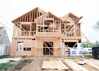 Legacy Home Remodleing  House under construction with exposed wooden frame structure.