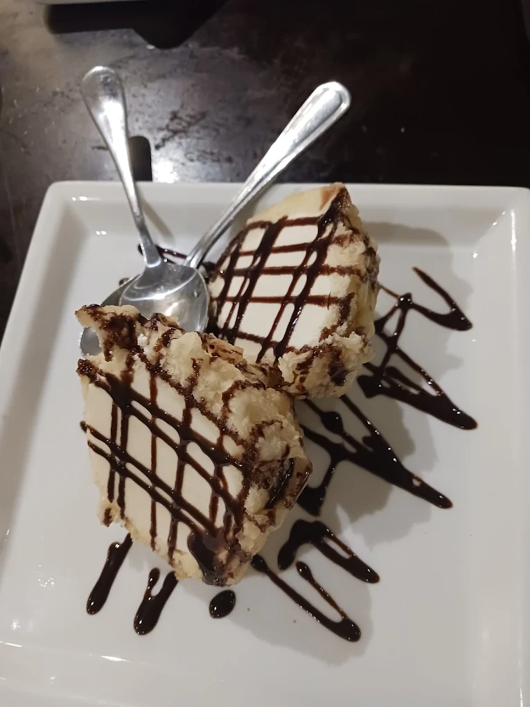 Inatome Japanese Steak + Sushi products and services showcasing hibachi preparation