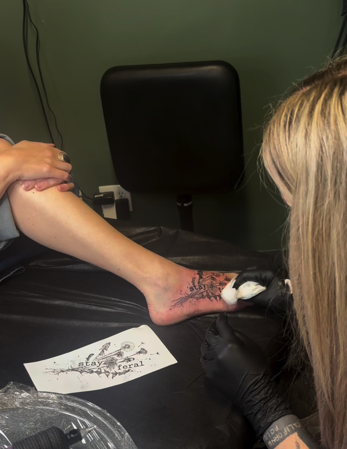 Tattoo artist inking 