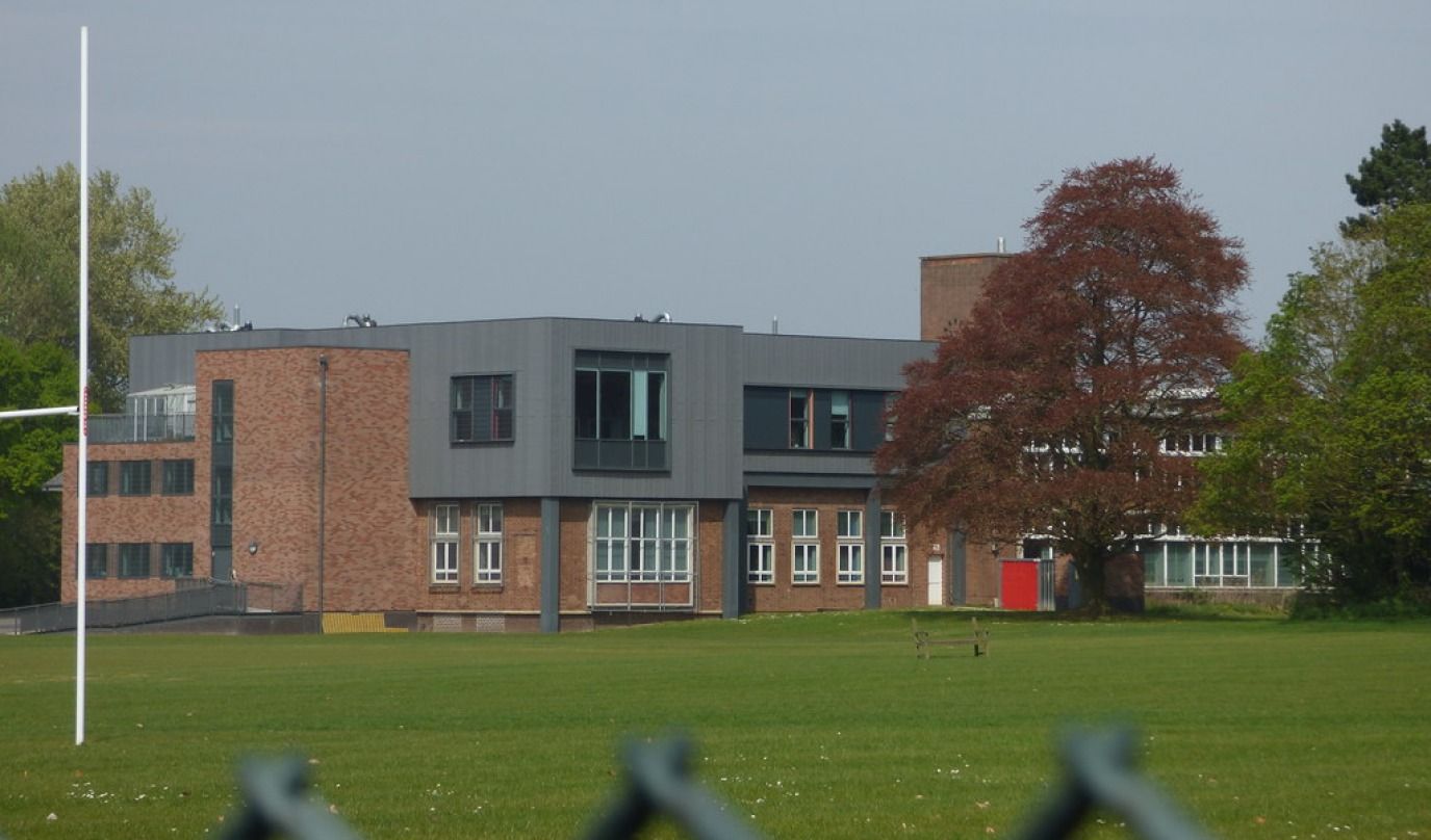 View across the sports pitch towards one of the buildings at King Edward VI Camp Hill School for Boys