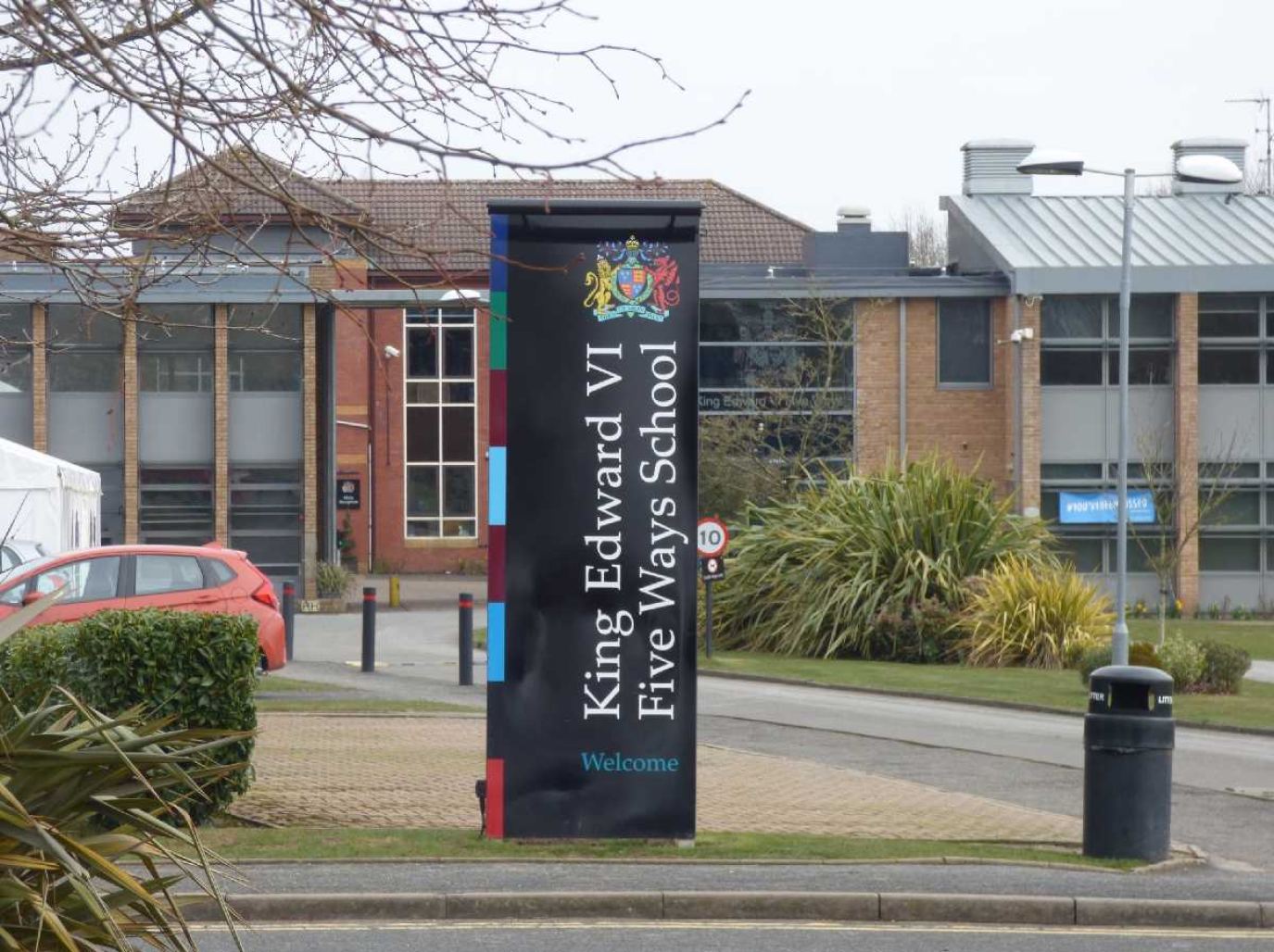 The main entrance and welcome banner at King Edward VI Five Ways School