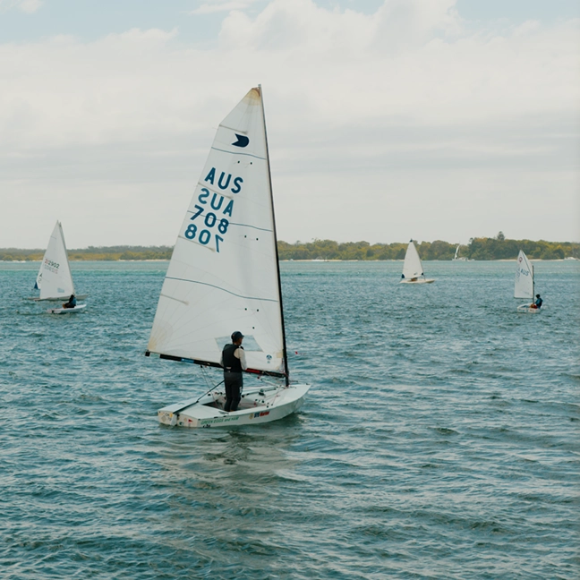 Sailors racing small yachts on the Gold Coast waterways for Southport Yacht Club