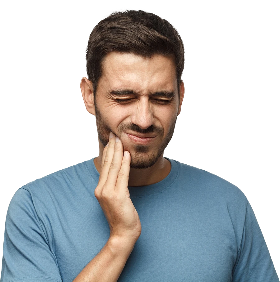 Man in blue shirt grimacing and holding his cheek in pain, showing toothache or jaw discomfort.