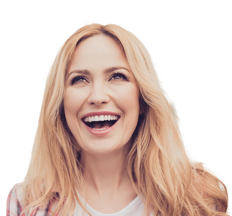 Smiling blonde woman looking upwards with an open mouth, wearing a light-colored top and plaid shirt.