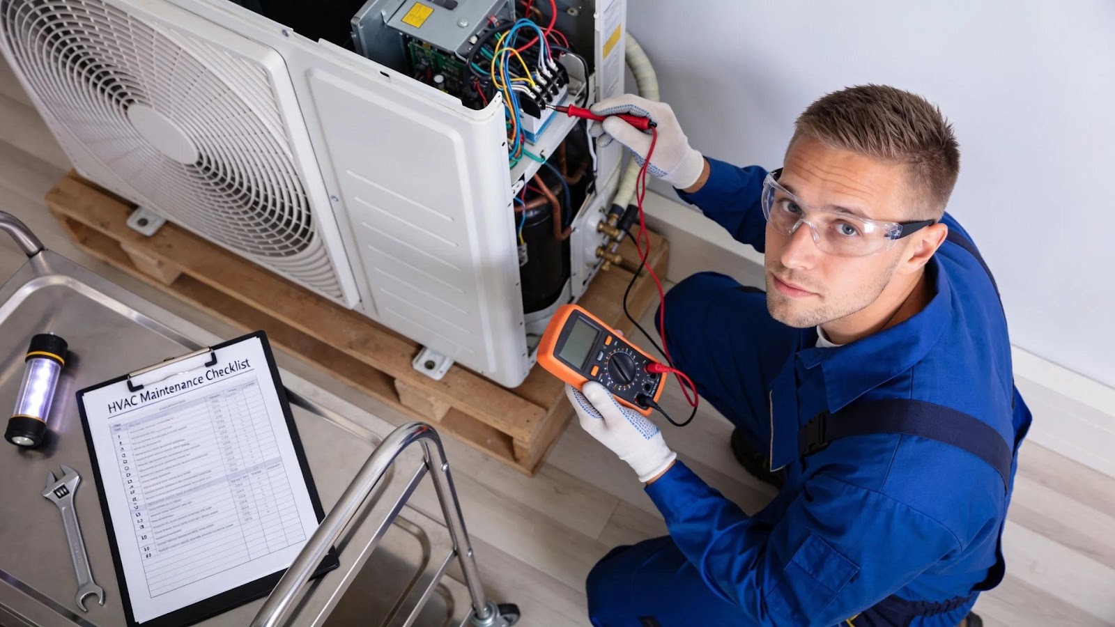 Technician inspecting HVAC unit using a checklist, showcasing thorough maintenance practices