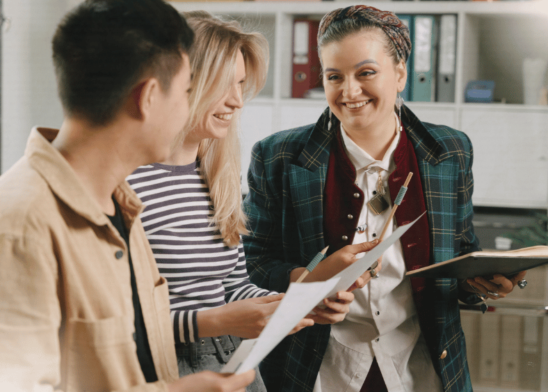 Three people in conversation at work