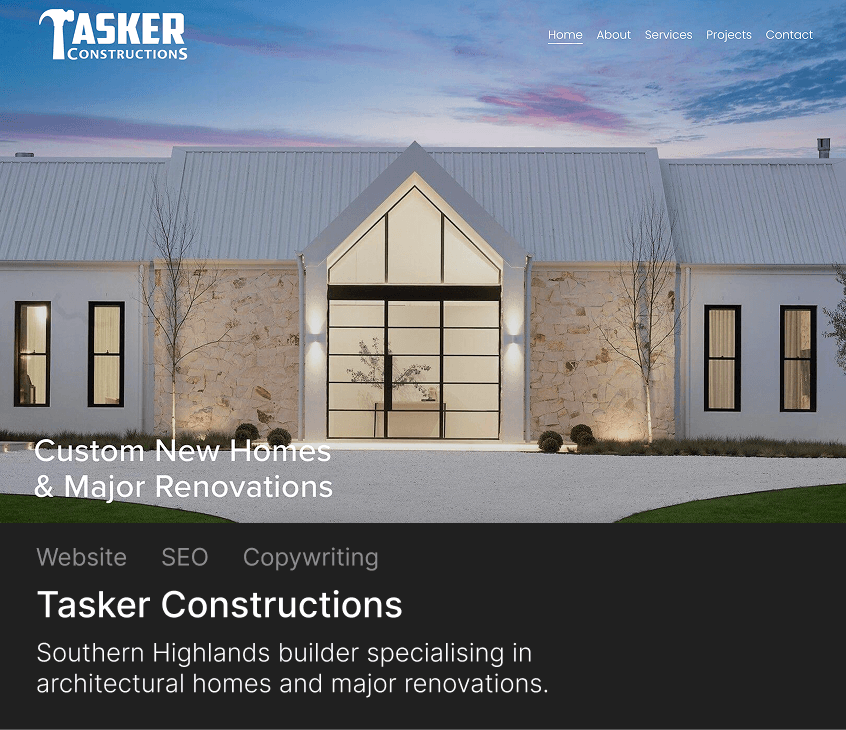 Modern custom home with large glass entrance, stone walls, and illuminated exterior at dusk.