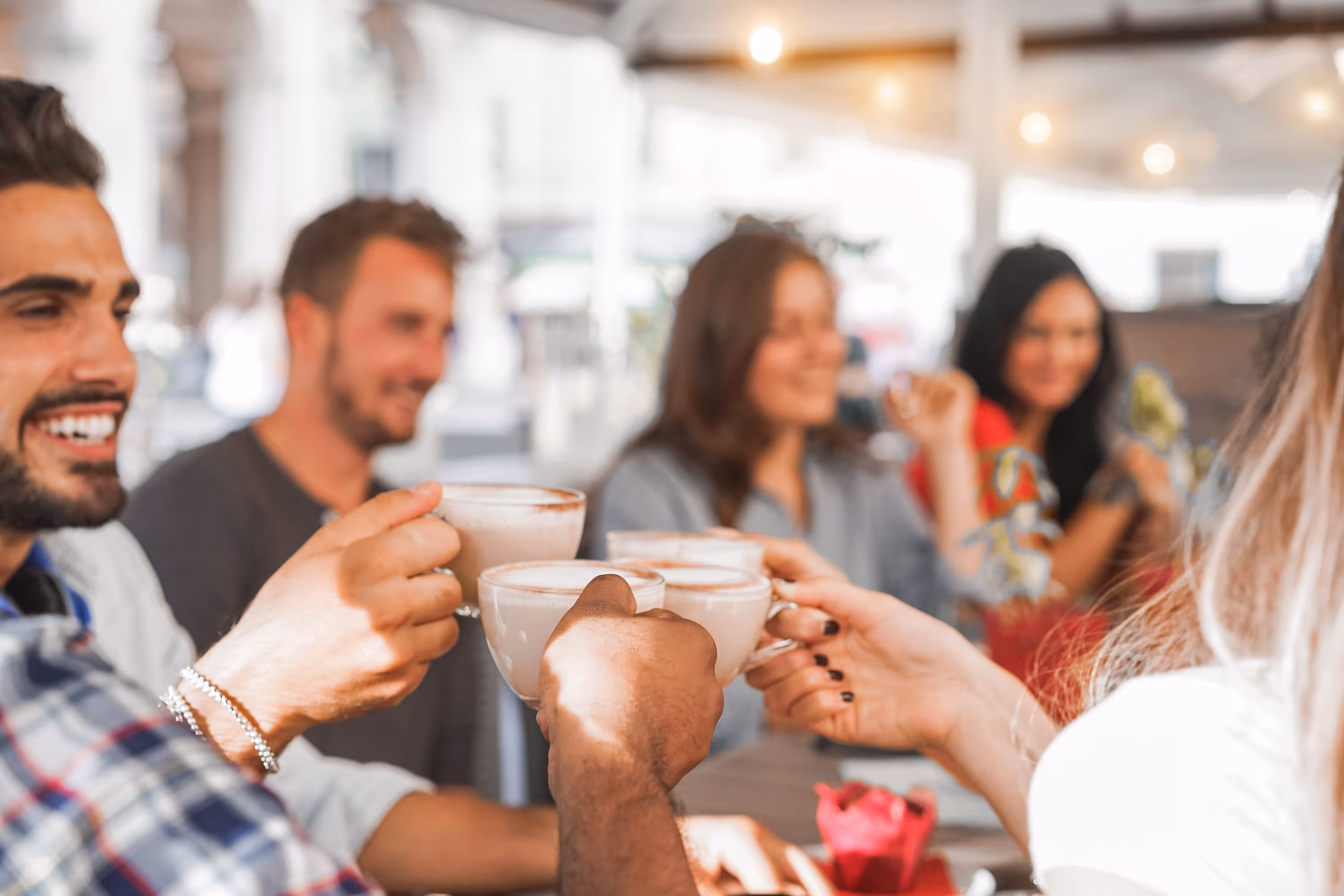 Residents enjoying coffee at a local café near ArtHaus Telegraph apartments, highlighting the vibrant neighborhood social life.