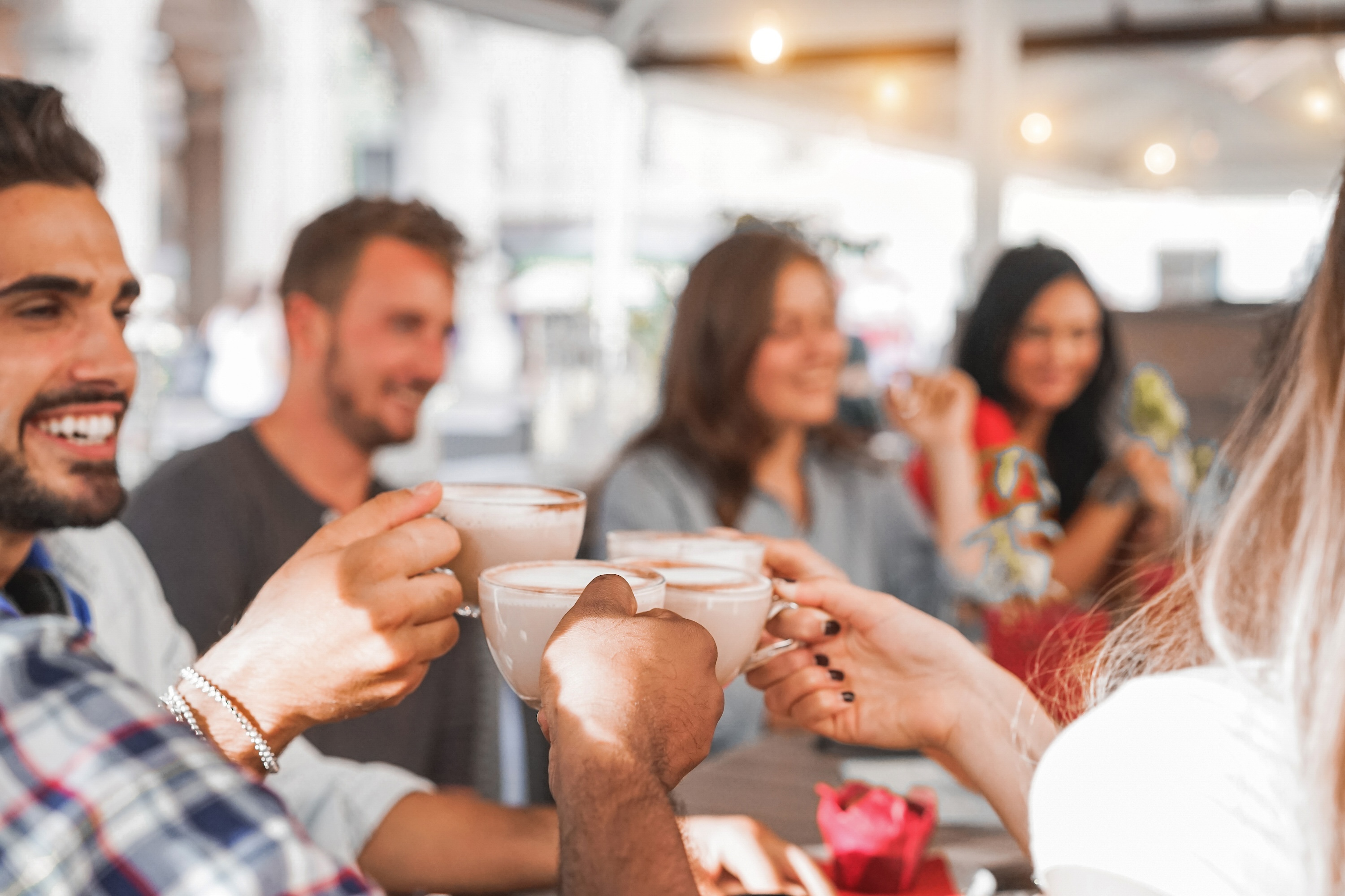 Residents enjoying coffee at a local café near ArtHaus Telegraph apartments, highlighting the vibrant neighborhood social life.