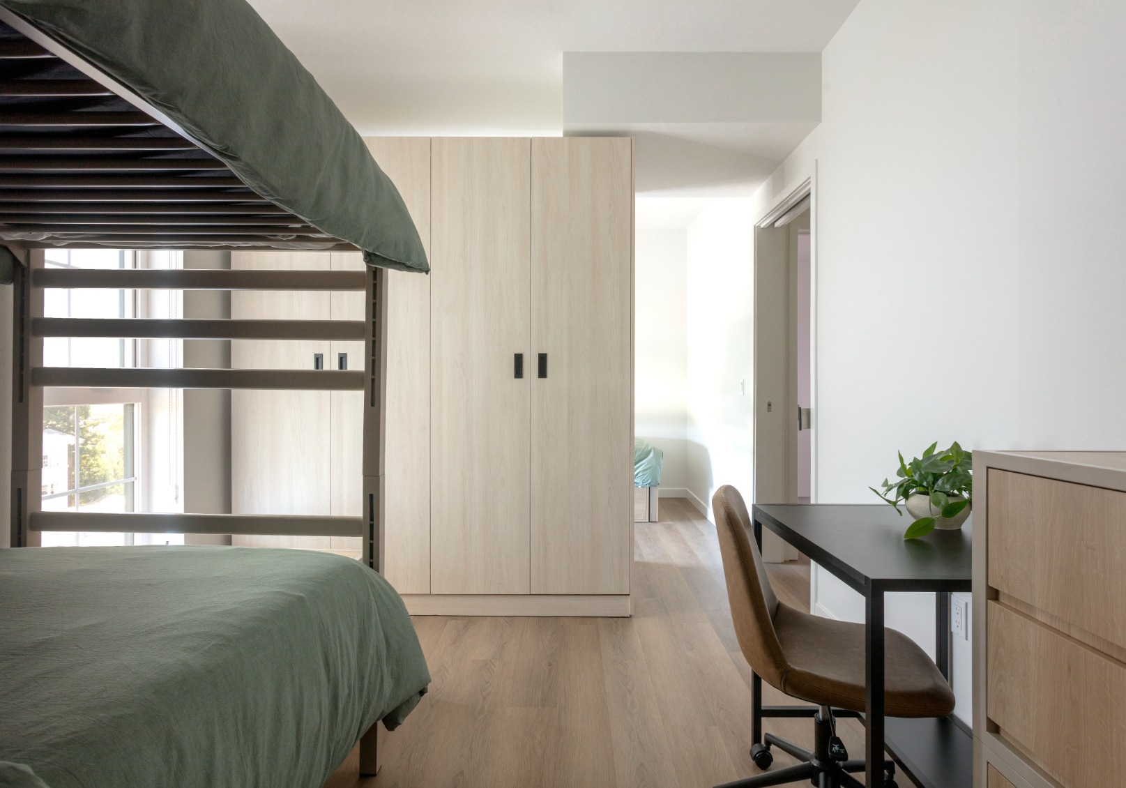 Apartment bedroom with bunk beds at ArtHaus Telegraph in Berkeley, CA.