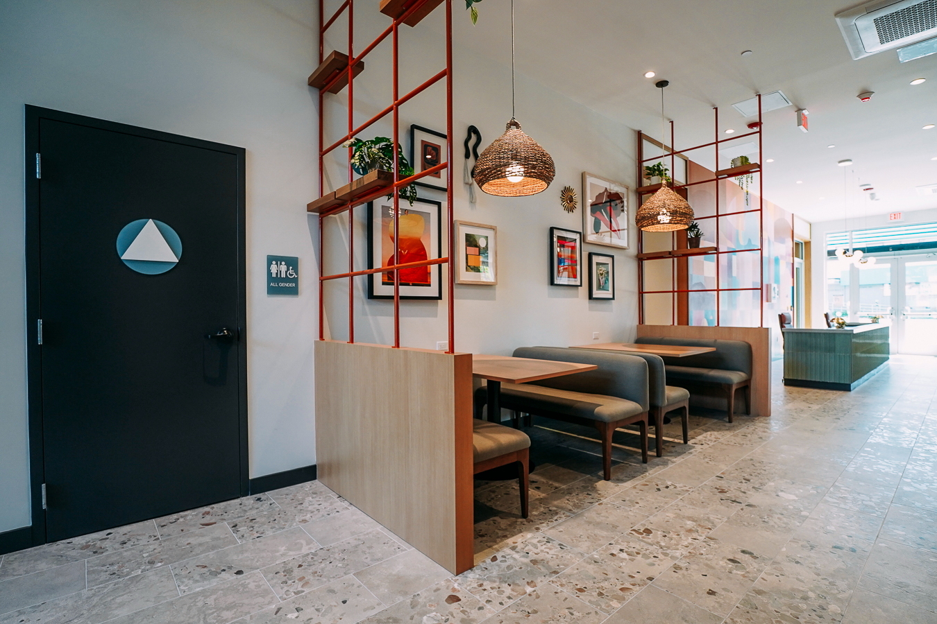 Resident amenity space featuring a stylish, speckled terrazzo coffee bar area with baked goods and green accent seating at ArtHaus Telegraph in Berkeley, CA.