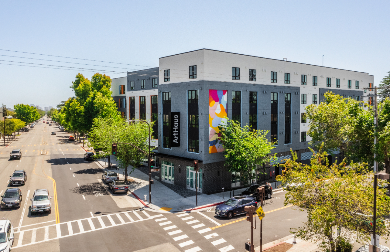 ArtHaus Telegraph Exterior drone shot with street view of park cars