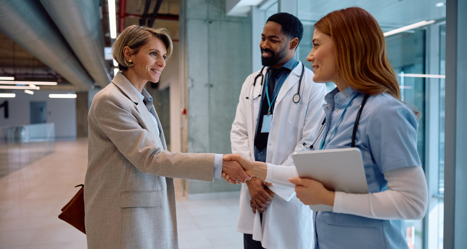 Concierge doctor in Great Neck, NY, greeting a patient at a modern medical office for personalized healthcare services.