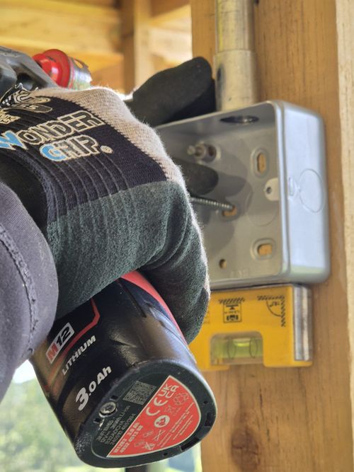 LED downlight installation in a modern Derby home with evenly spaced ceiling lights providing warm, practical interior lighting