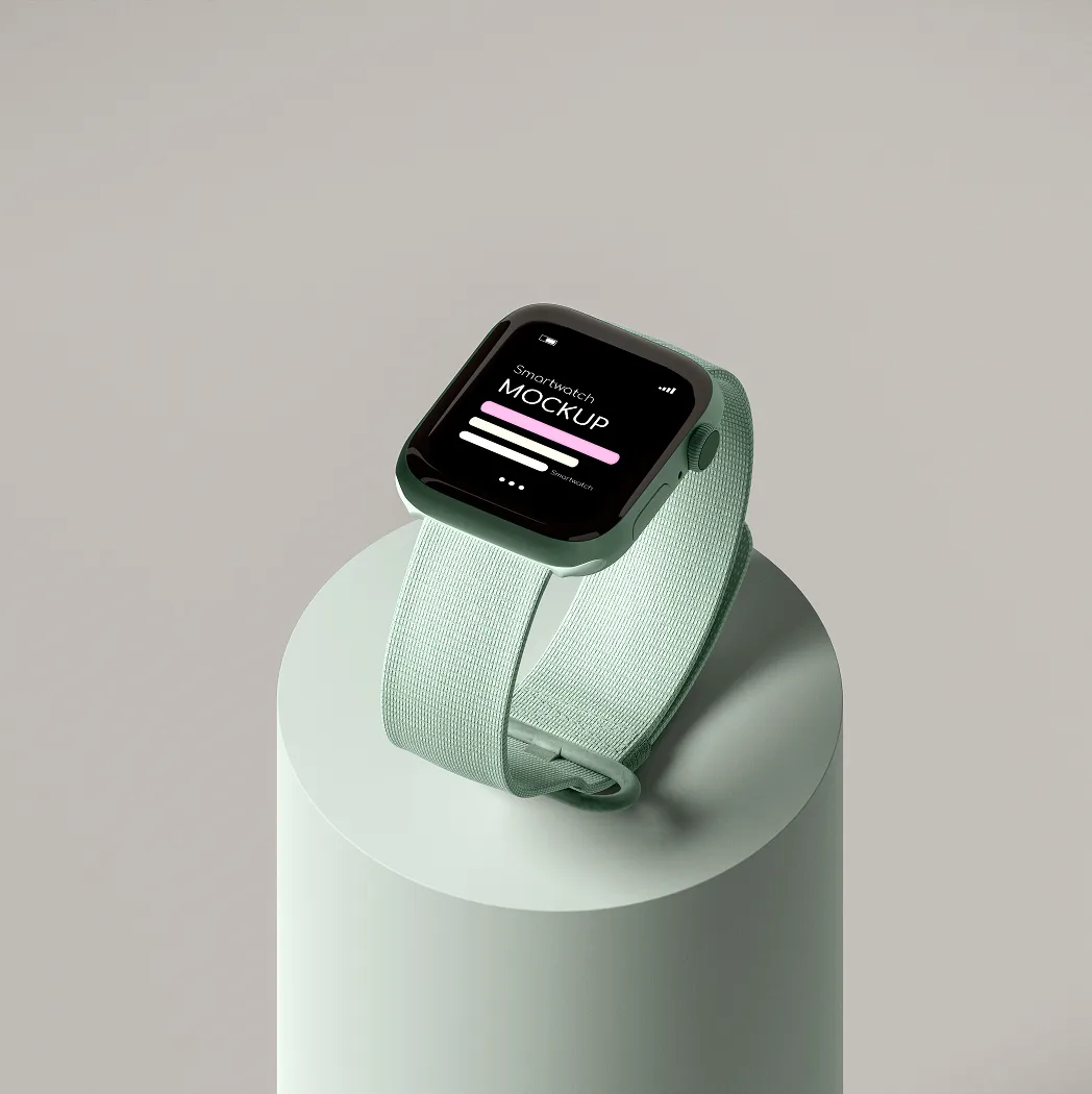 Smartwatch with a fabric strap displayed on a cylinder pedestal.