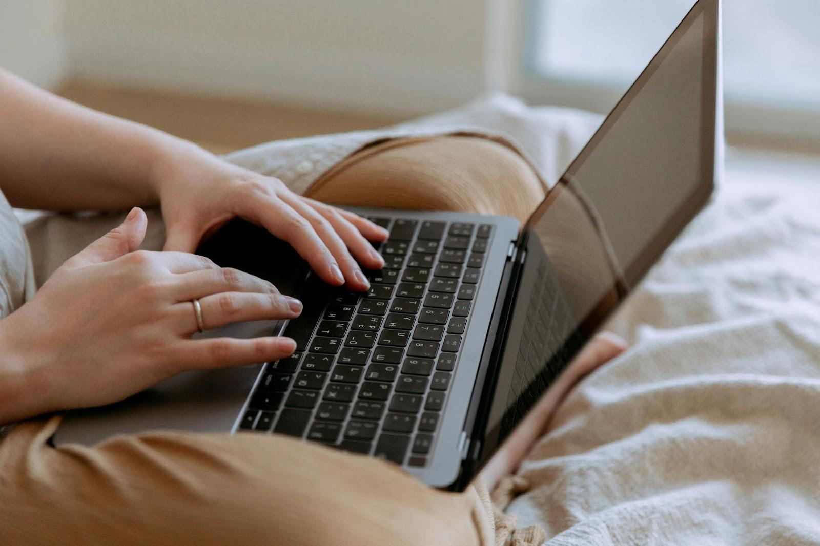 At home employee working with sensitive information on laptop.