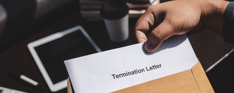 employee holding a termination letter