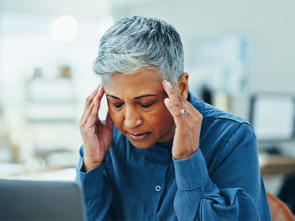 mature-frustrated-woman-headache-with-laptop-deadline-overworked-strain-office-senior-female-person-migraine-with-stress-pain-anxiety-vertigo-dizziness-workplace