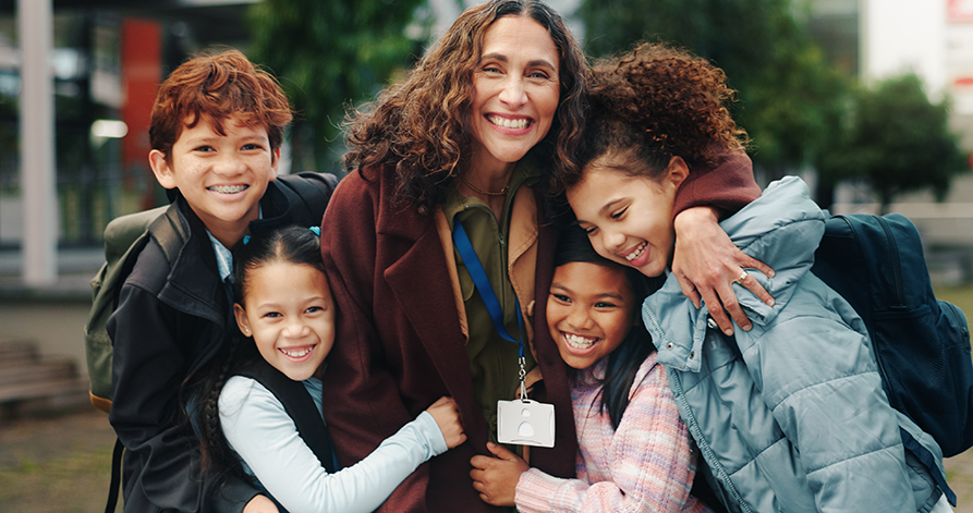 Woman with children hugging and smiling