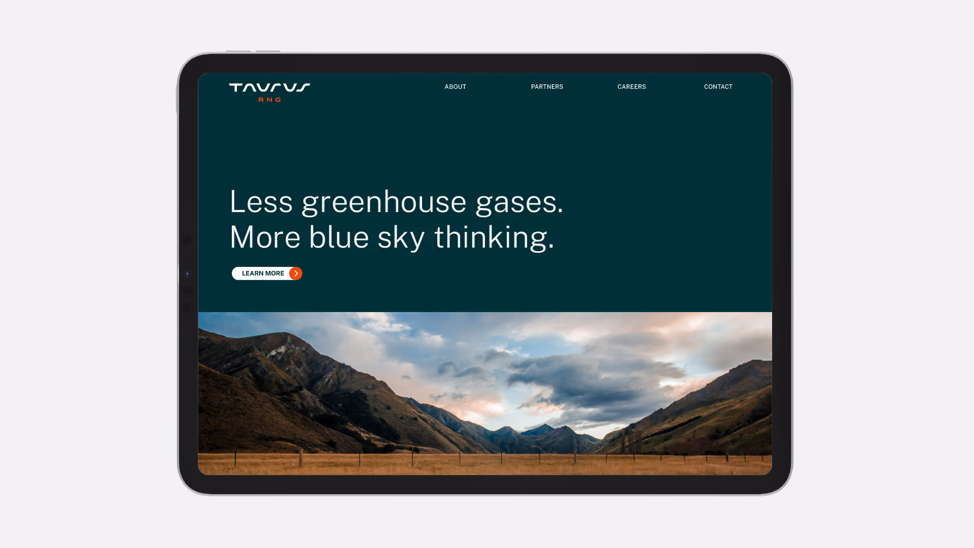 Tablet screen showing a website with dark teal background displaying the text 'Less greenhouse gases. More blue sky thinking.' above a scenic mountain landscape photo and a Learn More button, with navigation links for About, Partners, Careers, and Contact at the top.