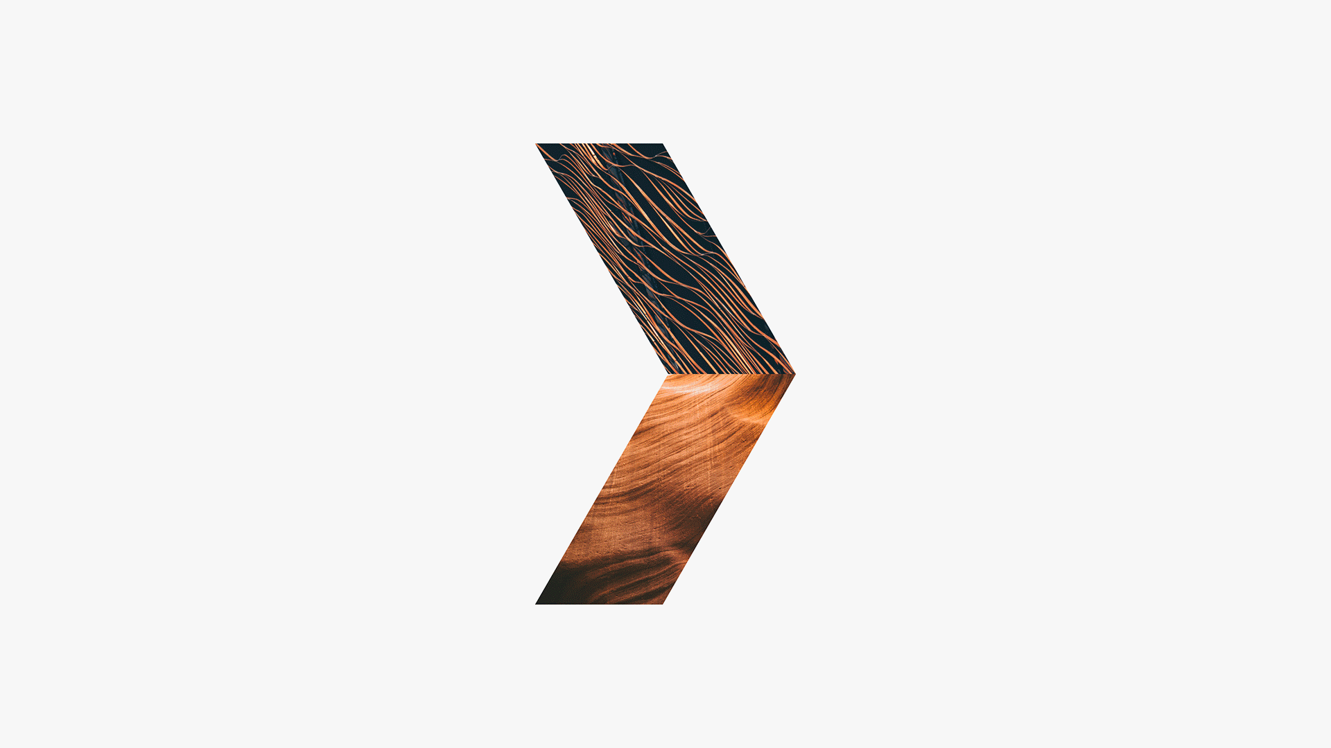 Abstract right-pointing arrow shape filled with textural imagery against a light gray backdrop.